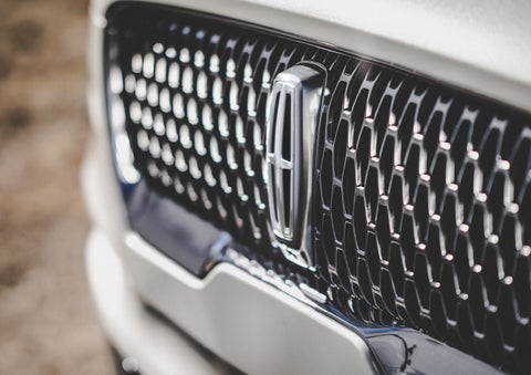 The grille of the 2024 Lincoln Aviator® Reserve model with an eye-catching repeated field of Lincoln Star logo shapes | Koons Lincoln of Bethesda in Silver Spring MD
