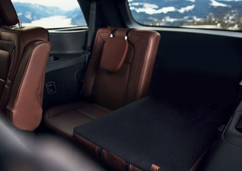 The left rear seat of a 2024 Lincoln Aviator® SUV is shown folded flat for additional cargo space | Koons Lincoln of Bethesda in Silver Spring MD