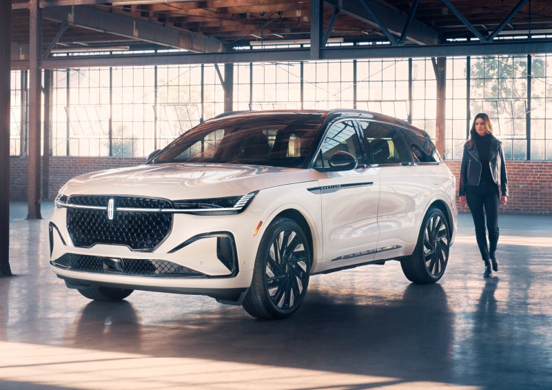 A person approaches a 2024 Lincoln Nautilus® SUV. | Koons Lincoln of Bethesda in Silver Spring MD