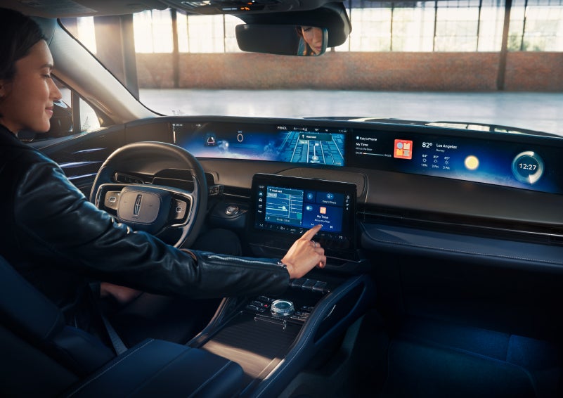 The driver of a 2024 Lincoln Nautilus® SUV interacts with the center touchscreen. | Koons Lincoln of Bethesda in Silver Spring MD