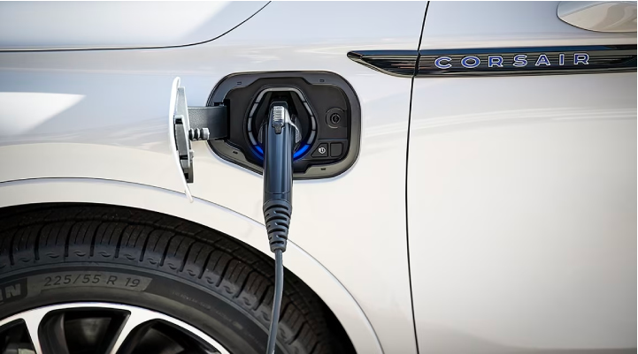 An electric charger is shown plugged into the charging port of a Lincoln Corsair® Grand Touring
model. | Koons Lincoln of Bethesda in Silver Spring MD