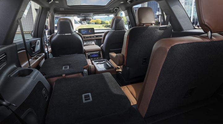 One side of the PowerFold® third-row seat and a second-row seat are folded forward in the 2026 Lincoln Aviator® SUV. | Koons Lincoln of Bethesda in Silver Spring MD