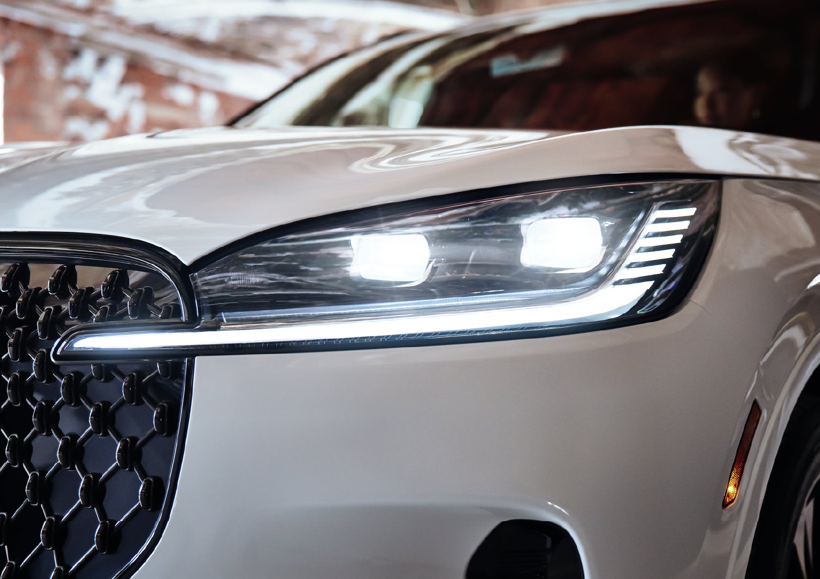 A close-up of a headlamp on the 2027 Lincoln Aviator® SUV is shown. | Koons Lincoln of Bethesda in Silver Spring MD