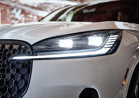A close-up of a headlamp on the 2027 Lincoln Aviator® SUV is shown. | Koons Lincoln of Bethesda in Silver Spring MD