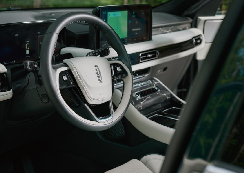 The leather-trimmed steering wheel of a 2027 Lincoln Aviator® Black Label™ SUV. | Koons Lincoln of Bethesda in Silver Spring MD