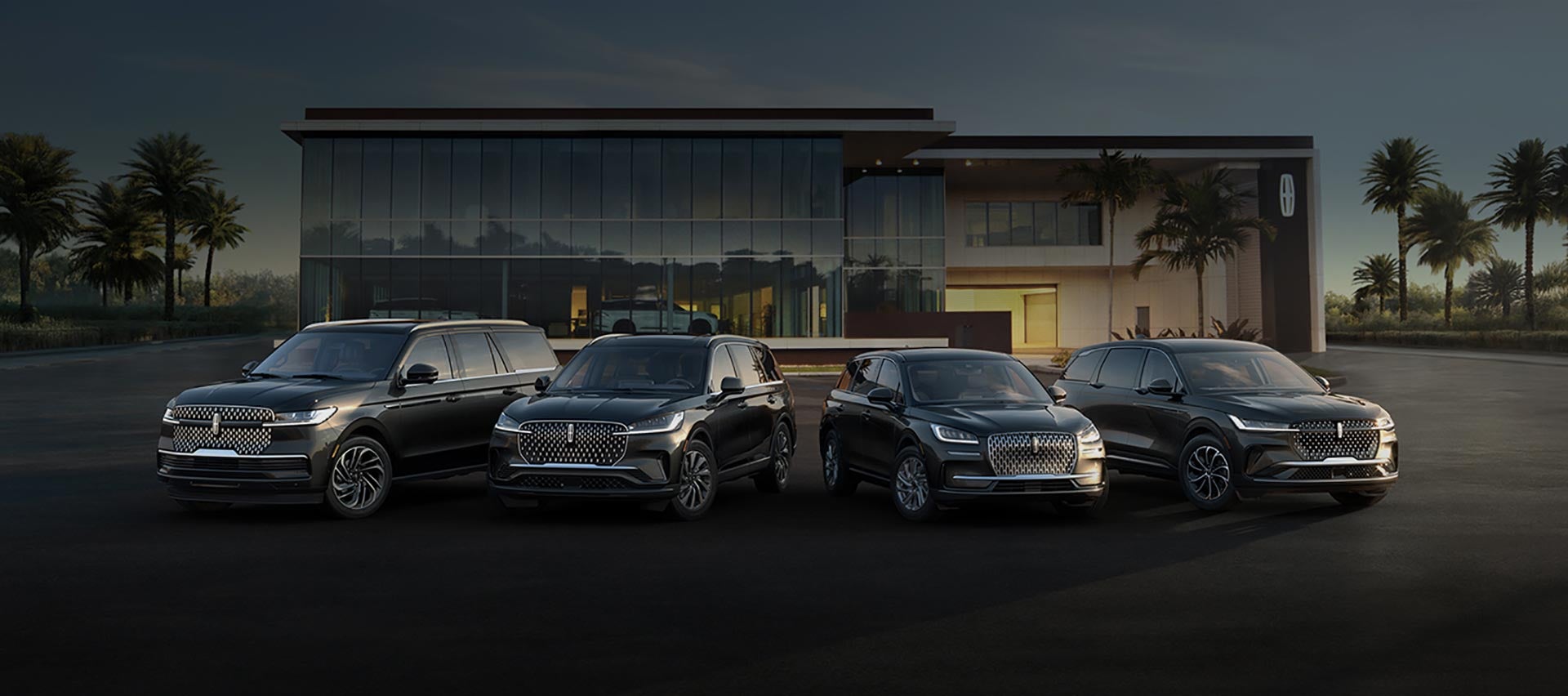 A group of Lincoln SUVs are parked in front of a Lincoln Retailer parking lot.